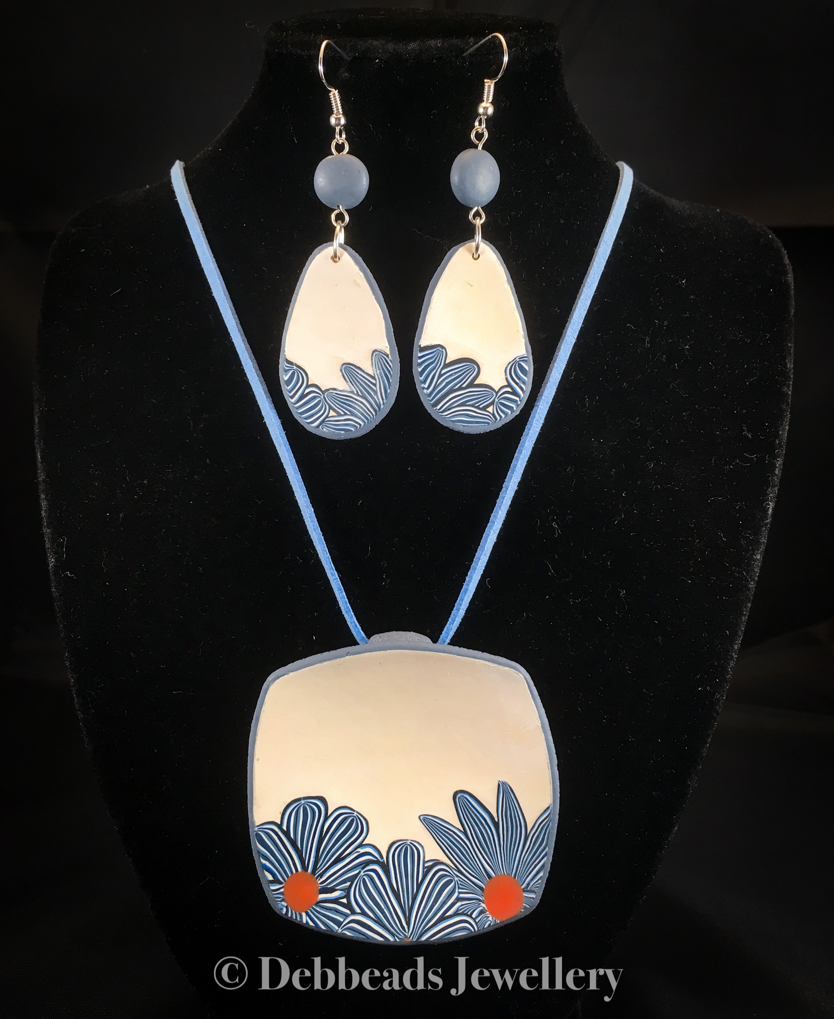 White Square Pendant with blue stripy flowers - showing with matching earrings