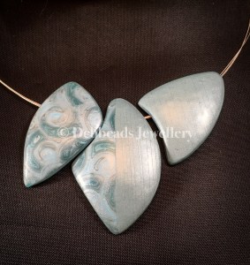 Silver/teal swirl triple bead necklace