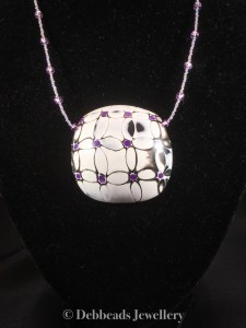 Black, white and purple mokume gane flower pendant